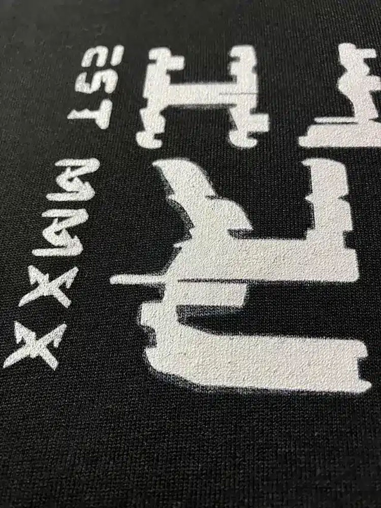 Faint offset shadow of the design near the print